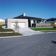 Exterior view of this modern home - Exterior architecture, asphalt, building, estate, facade, home, house, property, real estate, residential area, roof, sky, suburb, window, gray