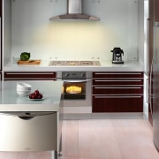 View of this modern kitchen featuring kitchen appliance cabinetry, countertop, cuisine classique, floor, home appliance, interior design, kitchen, kitchen stove, product design, room, gray