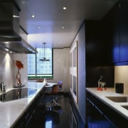 View of this modern kitchen with silver and ceiling, countertop, interior design, kitchen, room, black, gray