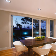 View of the dining area - View of ceiling, daylighting, dining room, door, hardwood, home, house, interior design, lighting, living room, real estate, room, wall, window, wood, wood flooring, brown, gray