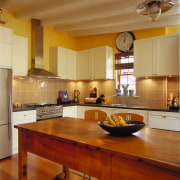 View of this kitchen area - View of cabinetry, ceiling, countertop, cuisine classique, floor, flooring, hardwood, interior design, kitchen, real estate, room, under cabinet lighting, wood flooring, brown, orange