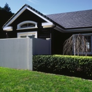 View of this home - View of this architecture, backyard, cottage, facade, grass, home, house, property, real estate, residential area, roof, shed, siding, sky, suburb, yard, black