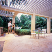 exterior view of outdoor living space under vergola backyard, estate, house, outdoor structure, patio, real estate, yard, gray