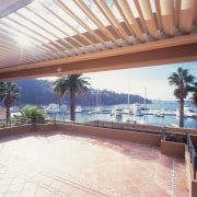 Outdoor patio area under vergola - Outdoor patio apartment, daylighting, estate, leisure, outdoor structure, property, real estate, resort, roof, shade, swimming pool, villa, white