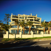 roadside view of apartments - roadside view of apartment, architecture, arecales, building, city, condominium, estate, facade, home, house, metropolitan area, mixed use, neighbourhood, palm tree, property, real estate, residential area, sky, suburb, tree, blue