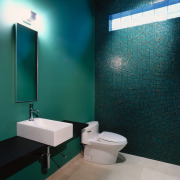 View of this modern bathroom - View of bathroom, blue, floor, glass, interior design, plumbing fixture, product design, public toilet, purple, room, sink, tile, toilet, wall, teal
