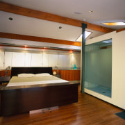 View of the bedroom and bath area - architecture, cabinetry, ceiling, floor, flooring, furniture, hardwood, interior design, room, wood, brown, orange