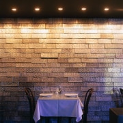 Restaurant table and chairs against feature wall of ceiling, daylighting, flooring, interior design, light, lighting, tile, wall, wood, black