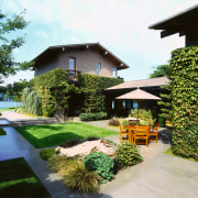 View of the backyard - View of the backyard, cottage, estate, facade, garden, grass, home, house, landscape, landscaping, lawn, outdoor structure, property, real estate, residential area, roof, yard, white