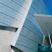 Side of building with no windows, using zinc angle, architecture, building, commercial building, corporate headquarters, daylighting, daytime, facade, headquarters, house, landmark, line, roof, sky, structure, teal