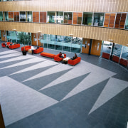 Tilework in main atrium of this building, with architecture, floor, flooring, roof, tile, gray