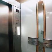 Lift area with aluminium doors and control panel, elevator, home appliance, gray, black