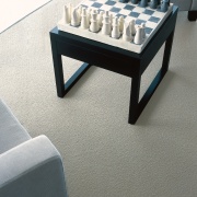 Black stool with chess set on natural coloured coffee table, floor, flooring, furniture, product design, table, gray, white