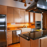 View of a kitchen, wooden flooring and cabinetry, cabinetry, countertop, cuisine classique, hardwood, interior design, kitchen, real estate, room, under cabinet lighting, wood flooring, brown