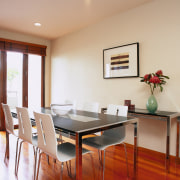 Dining room with long black and chrome table, chair, dining room, floor, furniture, interior design, property, real estate, room, table, gray