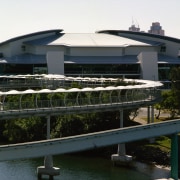 Exterior view of complex showing its low profile, architecture, building, corporate headquarters, marina, passenger ship, real estate, structure, water, waterway, black, white