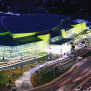 Night view looking down at convention complex with architecture, city, metropolis, metropolitan area, mixed use, night, sport venue, structure, urban area, blue