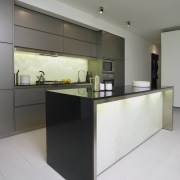 Showroom kitchen with grey cabinetry, dark stone benchtop, architecture, cabinetry, countertop, floor, interior design, kitchen, product design, property, real estate, gray