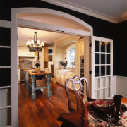 View of the kitchen and dining area, wooden cabinetry, ceiling, countertop, dining room, door, floor, flooring, hardwood, home, interior design, kitchen, living room, room, wall, window, wood, wood flooring, black, gray