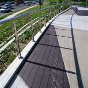 Concrete pathway with stainless steel balustrades and garden guard rail, handrail, line, path, road surface, walkway, gray