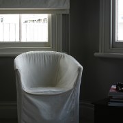 Seat with white covering in painted room, with chair, couch, floor, furniture, interior design, product, product design, table, window, black