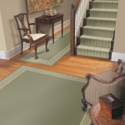 A view of a hallway, wooden flooring, grey carpet, floor, flooring, hardwood, interior design, laminate flooring, living room, room, tile, wall, wood, wood flooring, brown