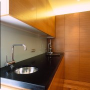 view of the granite kitchen benchtop, stainless steel architecture, bathroom, cabinetry, ceiling, countertop, floor, hardwood, interior design, kitchen, laminate flooring, lighting, room, sink, tile, under cabinet lighting, wall, wood, wood flooring, brown, orange