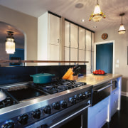 View of a kitchen, wooden flooring and cabinetry, cabinetry, countertop, interior design, kitchen, room, black, orange