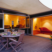 Decking area of black house with bifold doors home, interior design, living room, real estate