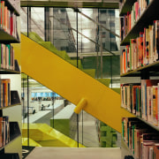 View of the library book shelves, white tiled architecture, building, institution, library, library science, public library, shelving, stairs, brown, orange