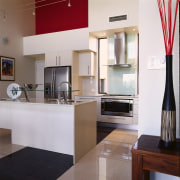 view of the kitchen area showing the stainless countertop, interior design, kitchen, real estate, room, white, gray