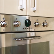 Wall oven with stainless steel finish. - Wall tap, orange