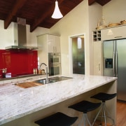 Kitchen with marble benchtop on island with sink, cabinetry, countertop, interior design, kitchen, real estate, room, brown