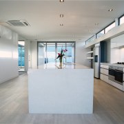 view of the kitchen lengthwise  showing timberflooring apartment, architecture, daylighting, floor, flooring, house, interior design, real estate, wood flooring, gray