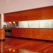 view of the madrona burr veneer cabinetry and architecture, cabinetry, ceiling, countertop, floor, flooring, furniture, hardwood, house, interior design, laminate flooring, lighting, orange, room, wall, window, wood, wood flooring, wood stain, red