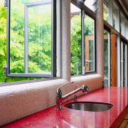 view of the kitchen benchtop looking into the daylighting, door, estate, home, house, interior design, real estate, window, wood, red