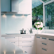 Kitchen with light coloured finish, rangehood and bay countertop, glass, home appliance, interior design, kitchen, room, gray, white