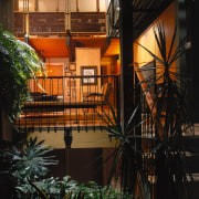 View of the open courtyard and idoor garden, architecture, balcony, building, facade, home, house, window, wood, black