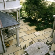 Outdoor eating area with sandstone pavers, and timber apartment, courtyard, home, house, outdoor structure, patio, property, real estate, roof, gray