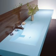 Bathroom with moulded blue basin and vanity, with angle, architecture, daylighting, floor, flooring, furniture, interior design, product design, sink, table, wood, black, gray