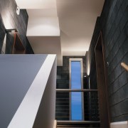 Stairway in house showing dark wall tiles, window apartment, architecture, ceiling, daylighting, house, interior design, stairs, wall, window, black, gray