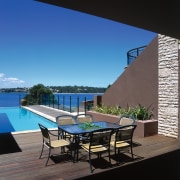 View of the dining are, wooden decking, stone apartment, architecture, condominium, daylighting, estate, home, house, interior design, leisure, outdoor furniture, patio, penthouse apartment, property, real estate, resort, sunlounger, swimming pool, table, black