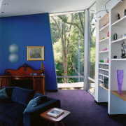 A view of this living area featuring blue architecture, ceiling, home, house, interior design, living room, real estate, room, wall, window, gray, blue