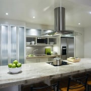 Stainless steel and glass canopy set over cooktop countertop, cuisine classique, interior design, kitchen, gray