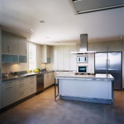 Kitchen with light coloured cabinetry, aluminium frames, island cabinetry, ceiling, countertop, floor, interior design, kitchen, real estate, room, gray