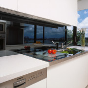 view of the kitchen area showing the stianless countertop, house, interior design, kitchen, property, real estate, window, white