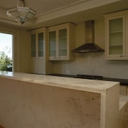 view of the kitchen shoing integrated marble and cabinetry, countertop, cuisine classique, estate, home, kitchen, real estate, room, window, brown