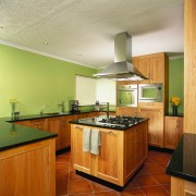 Kitchen with oak timber cabinetry, green granite benchtops, cabinetry, ceiling, countertop, cuisine classique, floor, flooring, hardwood, interior design, kitchen, real estate, room, wood flooring, brown, orange