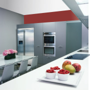 Showroom kitchen with light grey cabinetry and red countertop, home appliance, interior design, kitchen, product, product design, gray, white