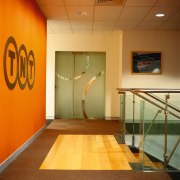 View of a glass door at the end ceiling, floor, flooring, glass, interior design, wall, orange, brown